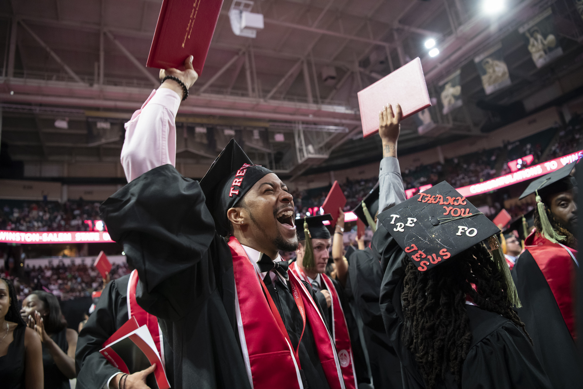 graduate celebrates at May's commencement ceremony