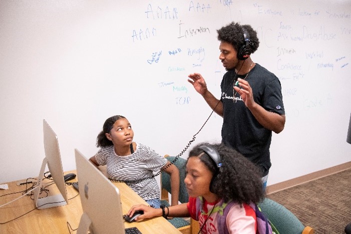 camp attendees using headphones