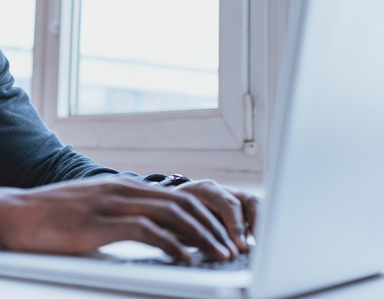 a person typing on a computer