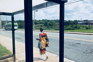 a woman at a bus stop