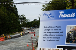 a closed road and transit sign