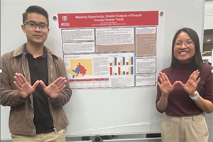 Professor Bao and a student 