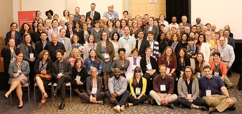 a large group of people posing for a photo