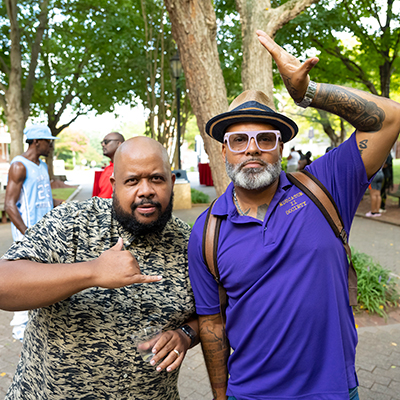 Two men enjoying a public event